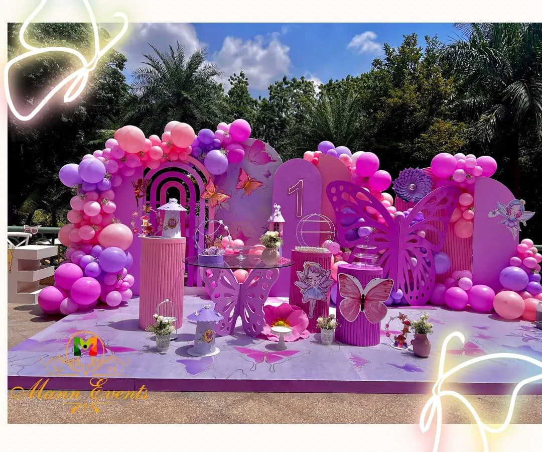 A first birthday should be pure magic. I brought this butterfly theme to life with a vibrant pastel palette, custom props, and a sea of balloons, creating an enchanting outdoor wonderland for a very special little girl.