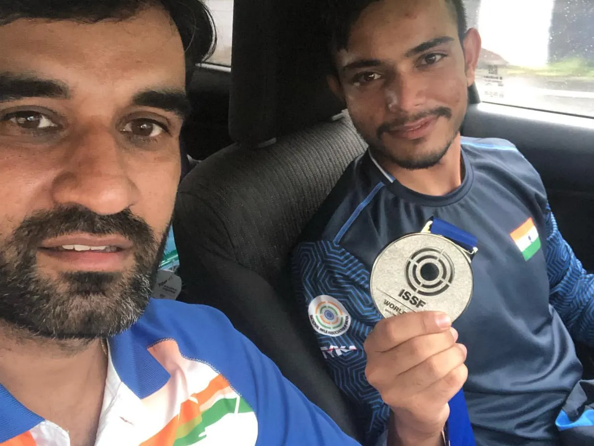 Celebrating a silver medal win at the ISSF World Cup in South Korea. International success is a journey we take together.