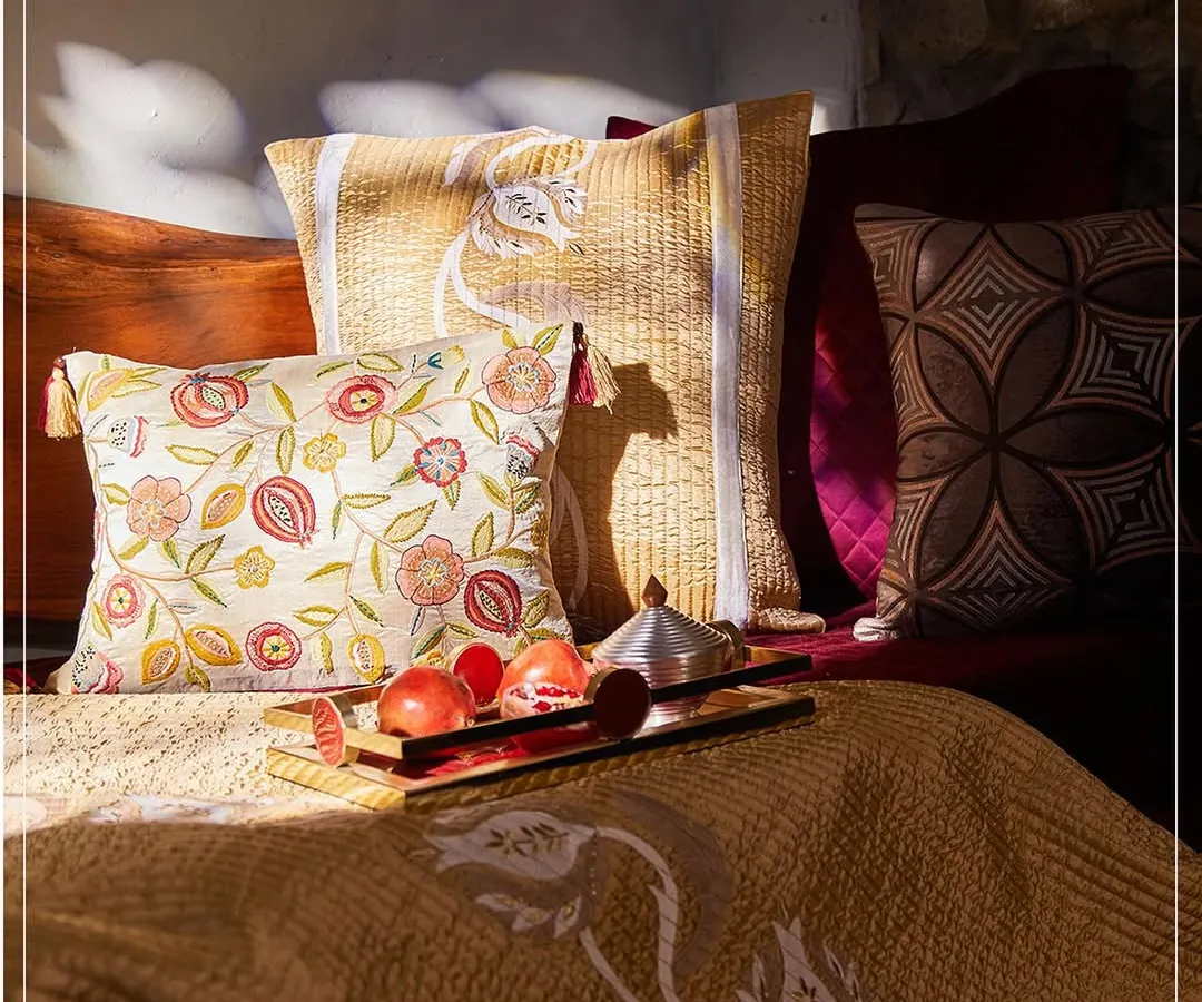 I believe your home should be a legacy. Here, the rich, pomegranate-inspired hues of my Anardana collection come to life, blending plush velvet textures with intricate embroidery to create a space that feels both grand and deeply personal.
