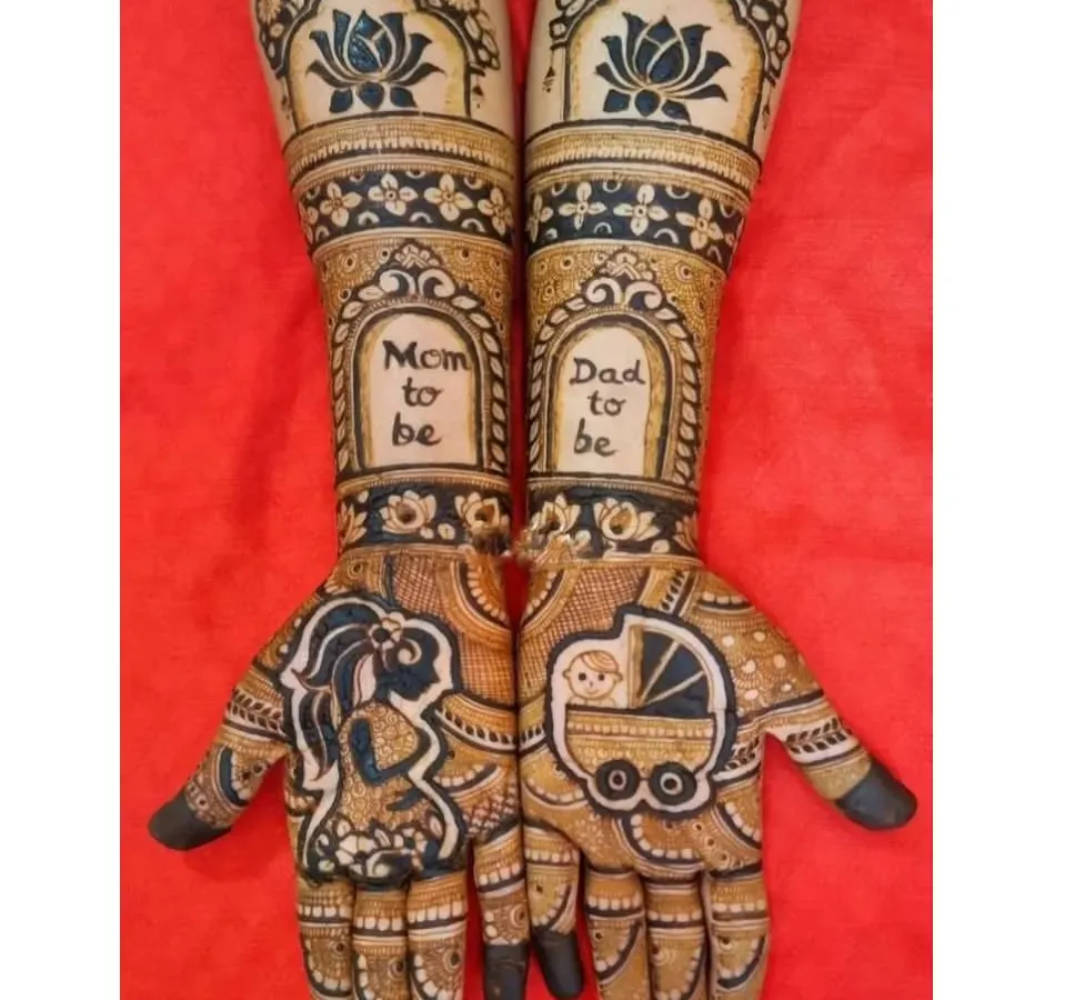 I love creating custom mehandi for baby showers. This design features a silhouette of an expecting mother, a baby in a pram, and the words "Mom to be" and "Dad to be" to celebrate the new journey.