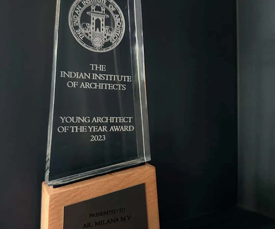 This is the 'Young Architect of the Year Award' trophy from the Indian Institute of Architects (IIA). We are honored to receive this prestigious award, which recognizes our dedication to contextual design and timeless aesthetics. The clarity of the crystal and the warmth of the wooden base reflect the core principles of our architectural practice.