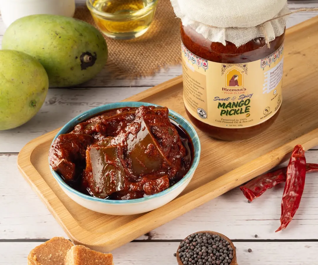 For this mango pickle shoot, I created a rustic, traditional scene to highlight the product's authentic flavor. The composition includes key ingredients like raw mangoes, jaggery, and spices to tell a complete story of taste and quality.
