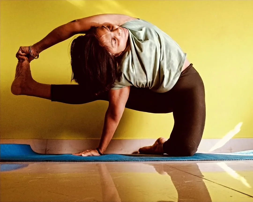 My personal practice is where I find my center. This is a variation of Parivrtta Eka Pada Rajakapotasana, a deep twisting pigeon pose that challenges balance and enhances spinal mobility. It’s a reminder that yoga is a continuous journey of purification for the body and soul.