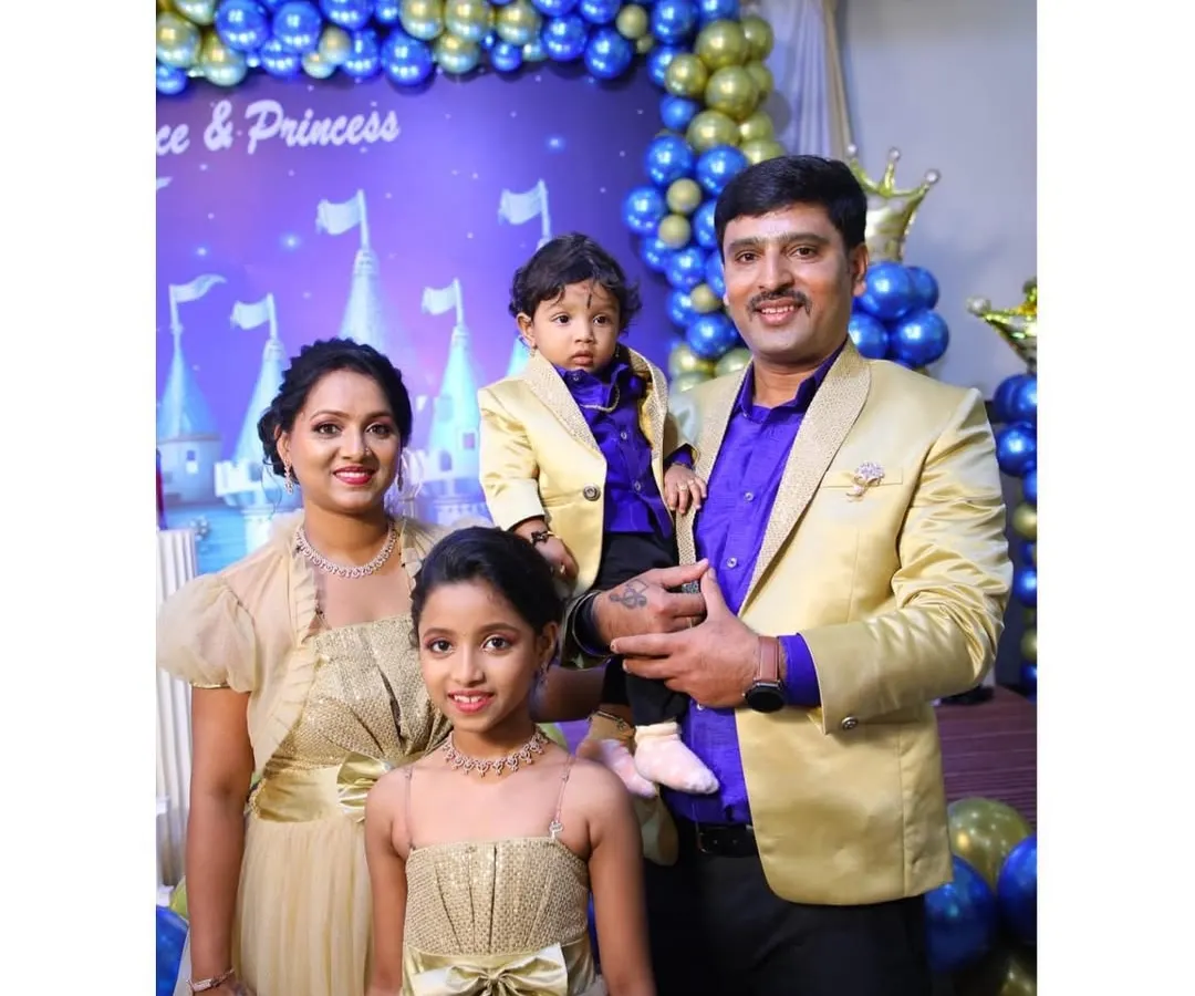 Here is a complete family set I designed for a birthday celebration. The parents and children are coordinated in a theme of gold and royal purple, with a custom gown for mom, a matching dress for the daughter, and smart blazers for dad and son.