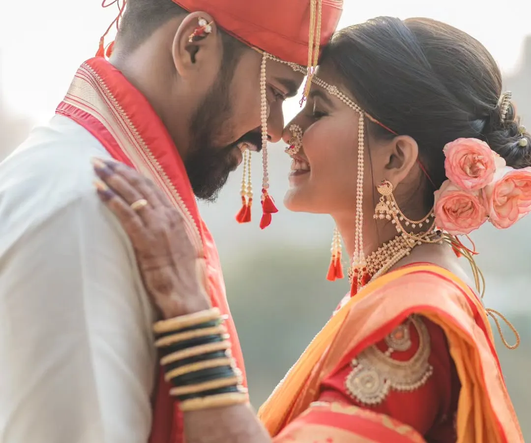 A quiet moment between a husband and wife on their wedding day. I focus on capturing these real, intimate connections that tell the true story of your love, creating timeless Maharashtrian wedding portraits.