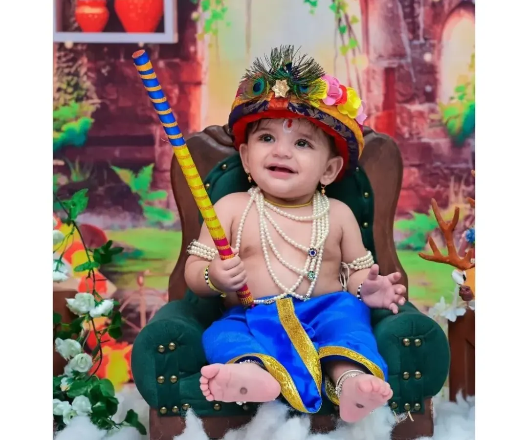 Here is a joyful Little Krishna, holding his flute with a happy grin. My cultural and festive photoshoots are designed with beautiful details, from the peacock feather crown to the traditional attire, to celebrate your heritage.