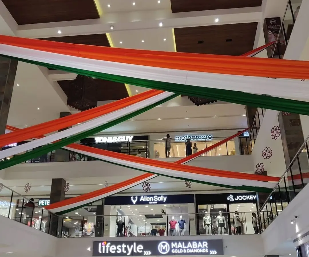 For this Independence Day project, we transformed a multi-level shopping mall with large, flowing tricolor fabric drapes. This shows our capability to handle large-scale commercial decoration projects, creating a patriotic ambiance that engages all visitors.