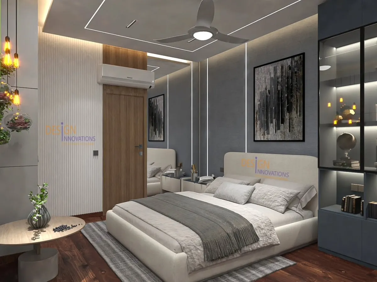 This master bedroom is a sanctuary of calm, designed with a sophisticated grey palette and warm wood flooring. We integrated custom backlit display cabinetry and layered lighting to create a mood that is both relaxing and elegant.