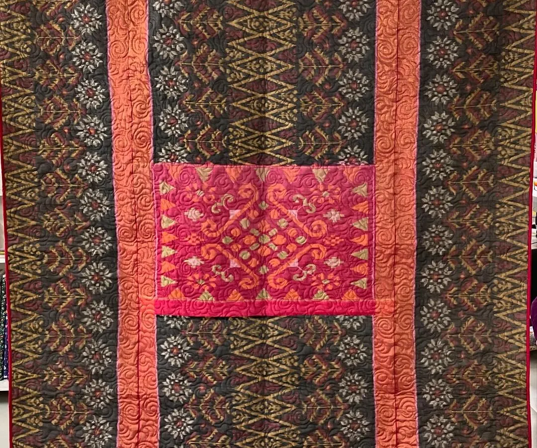 We specialize in transforming cherished sarees into beautiful, functional memory quilts. This piece preserves the intricate patterns and rich colors of a mother's saree, creating a reversible heirloom that can be passed down through generations.
