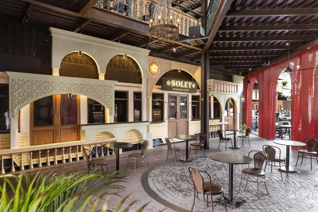 We designed the Soley European Cafe in Bangalore to be a journey through history and modern design. The facade recreates the charm of an Italian streetscape, complete with a vintage tram car entrance and architectural ruins. This commercial project shows how we translate a brand's story into a memorable physical experience for customers.