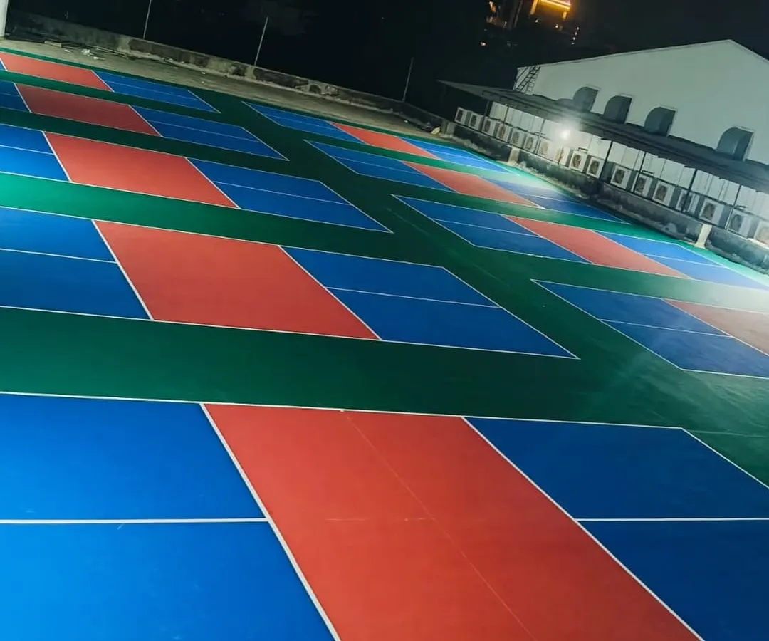 Our courts are fully lit and open 24/7 for those late-night matches or early morning practice sessions. This shot shows the arena after dark, highlighting the bright, even lighting across all playing surfaces.