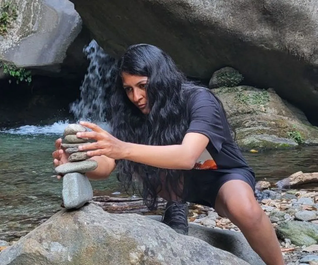 Finding balance, one stone at a time. For me, yoga is about creating moments of focus and stillness, whether on the mat or by a stream in the Himalayas. This practice of mindfulness is something I bring into every class.