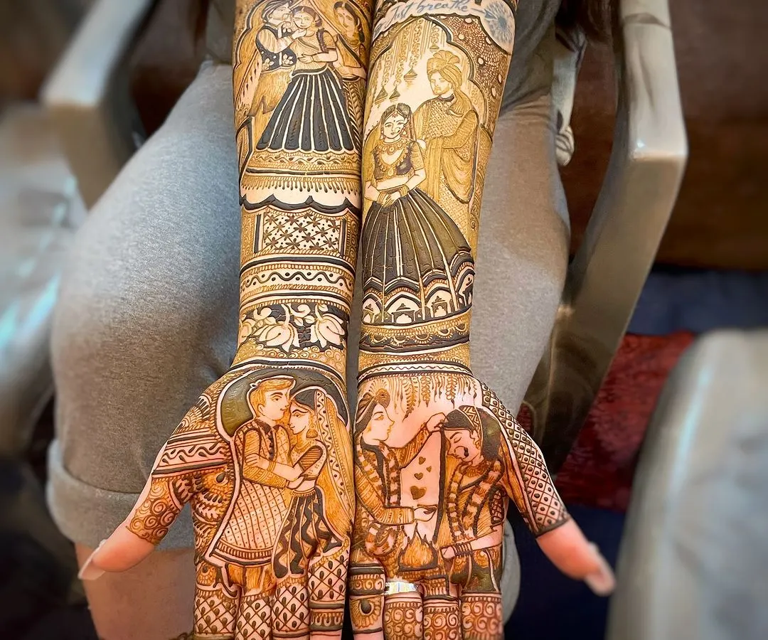 A complete bridal mehndi story across both arms. I designed multiple scenes for this bride, including couple portraits for the palms and different moments from her love story on the forearms. Every element is drawn with care to tell a cohesive story.