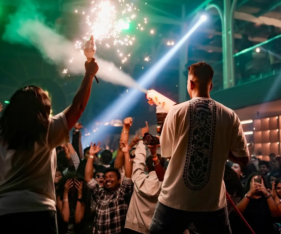 It's more than just music. I bring the full show with CO2 guns, cold pyros, and sparklers to make your event feel like a festival. Here's a glimpse of me lighting up the stage and the crowd.