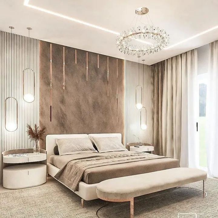 We designed this master bedroom as a serene and luxurious retreat. The space features a sophisticated palette of neutral tones, layered textures, and custom lighting, including a statement crystal chandelier and elegant pendant lights, to create a warm and inviting atmosphere.