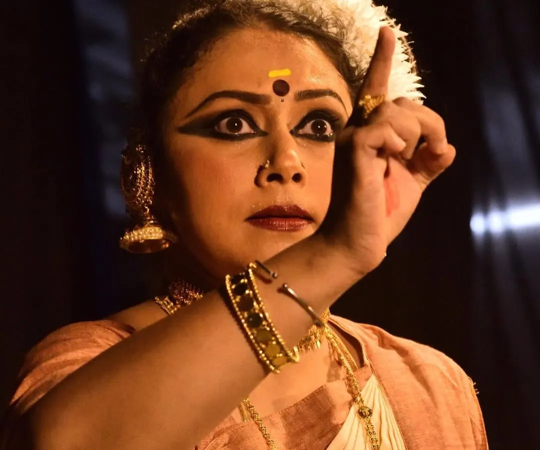 The essence of Mohiniyattam lies in its 'abhinaya' or expression. This is a close-up from a solo recital at Sreeramaswami temple, where every glance and gesture tells a story, allowing the dance to shine through the dancer.
