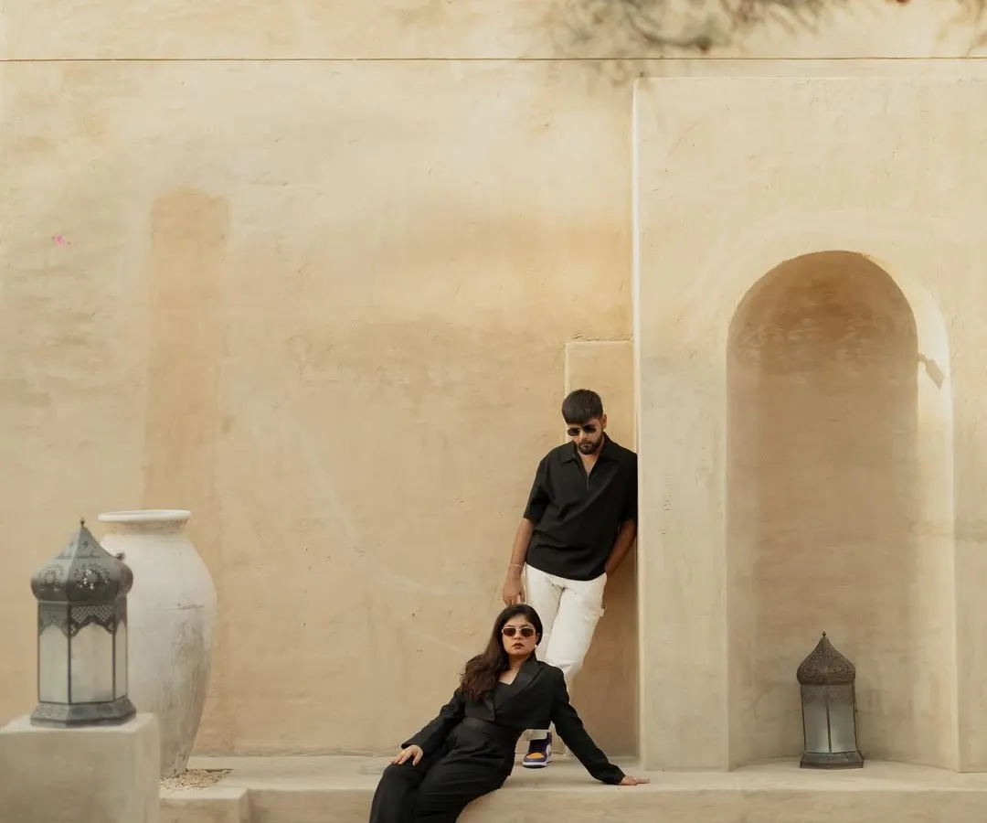 A pre-wedding shoot in Dubai, using the stunning architecture of Al Seef to create a modern, high-fashion portrait. This shows how we can blend your personal style with the character of a location for a truly unique concept.