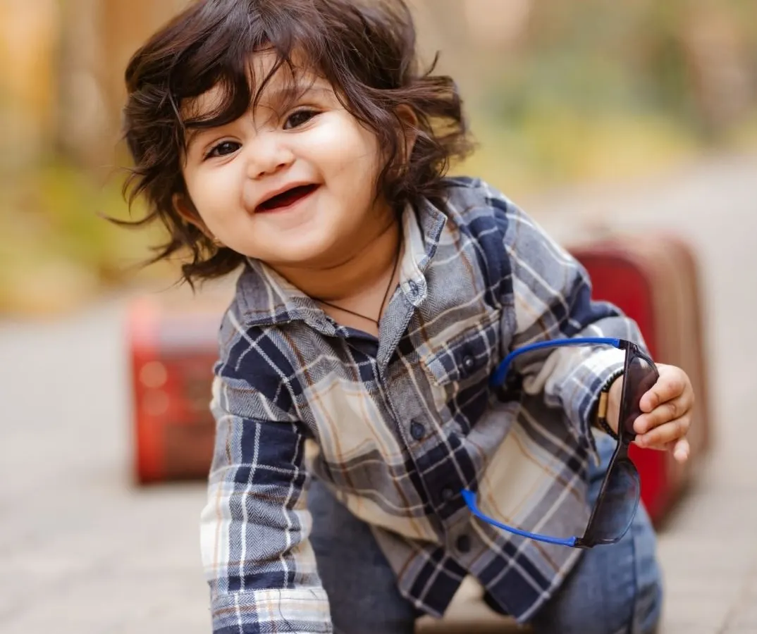 Capturing the pure joy of a baby on the move. This candid shot from a milestone session shows the genuine smiles and playful energy I strive to photograph.