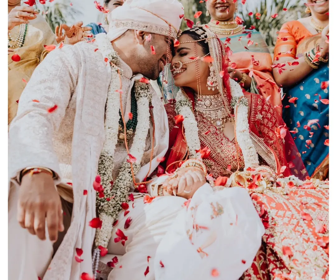 The moment it becomes real. Surrounded by loved ones and a shower of petals, their joy was so bright and infectious. This is the beautiful chaos I love to capture.