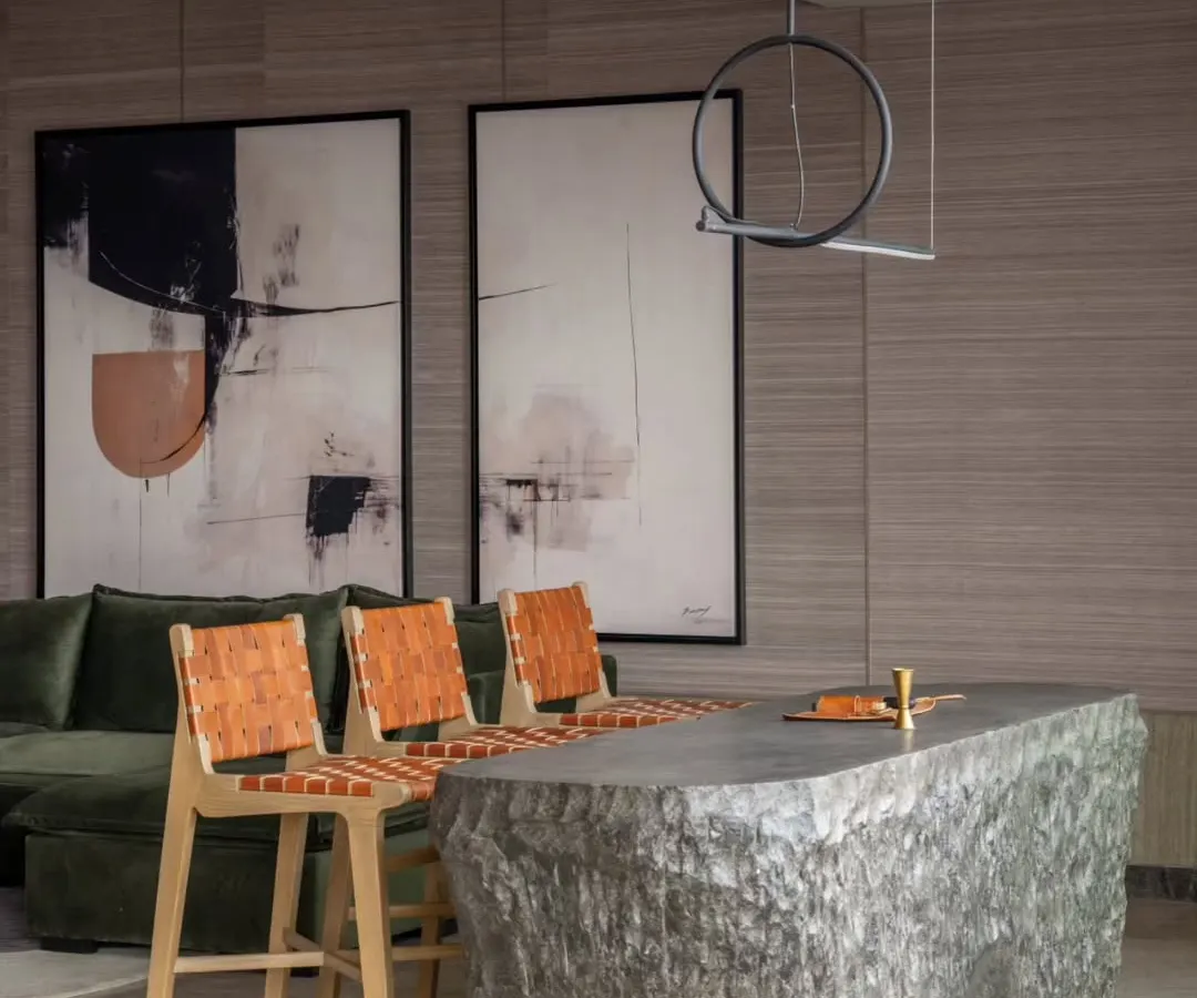 We love a little drama, and this bar counter, crafted from a single, hollowed-out block of stone, delivers just that. It’s a statement piece that anchors the home theatre area, showcasing our passion for using natural materials in bold, unexpected ways. This is custom craftsmanship at its most raw and refined.