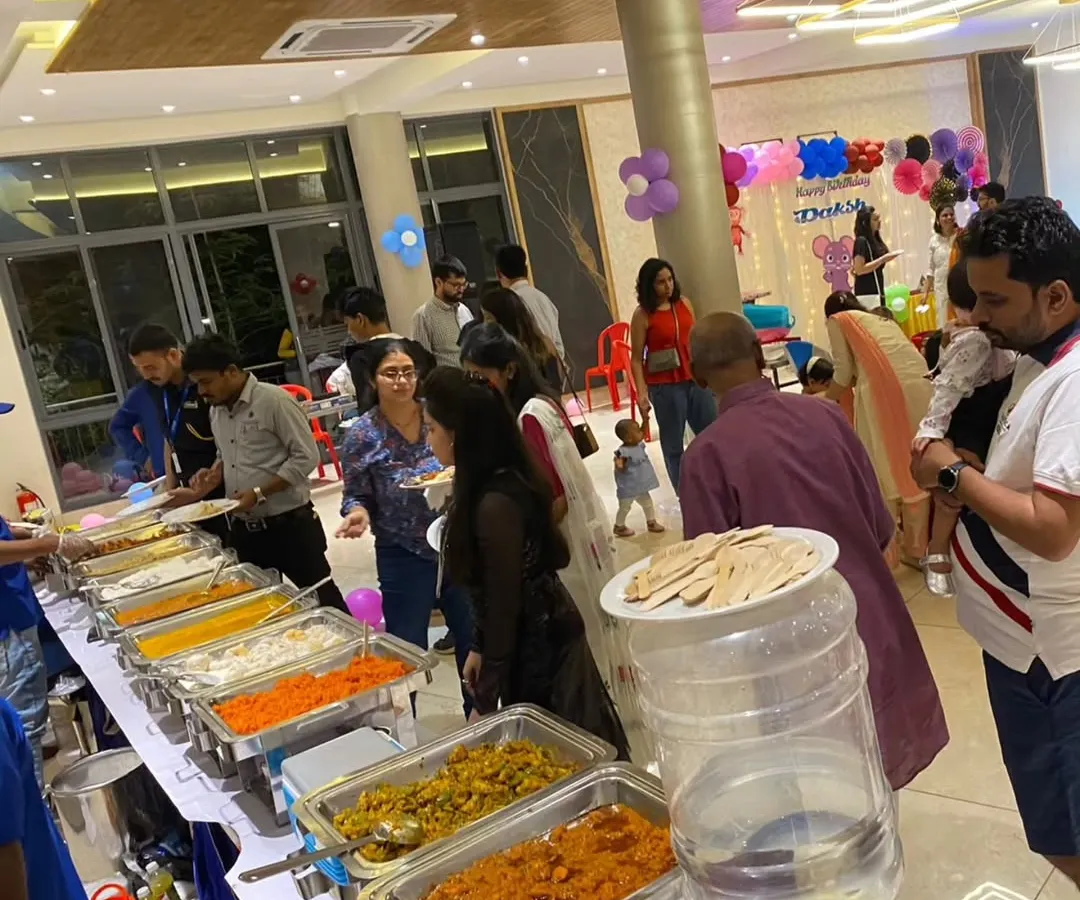 A vibrant buffet setup for a birthday party, with guests enjoying a wide selection of our vegetarian dishes. This shows our capability to cater for lively, modern celebrations with a diverse menu.