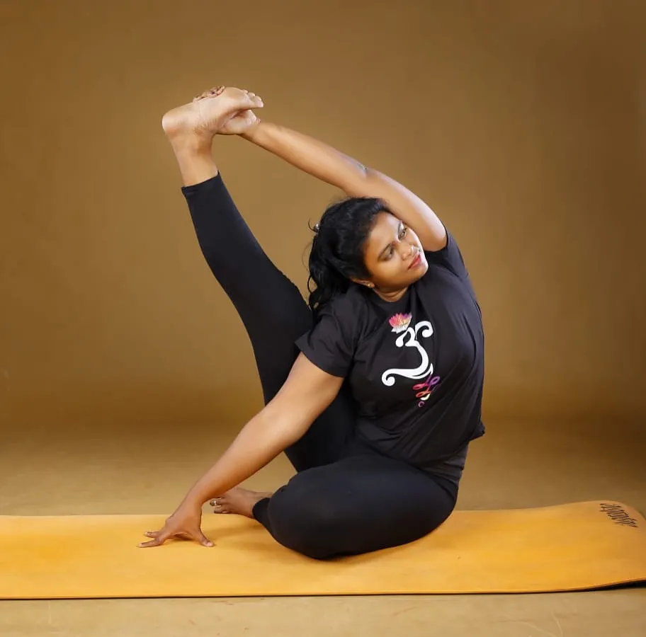 Our lead instructor, Prathima Arikeri, demonstrates an advanced posture that combines flexibility, strength, and focus. Her deep knowledge of yoga therapy and alignment ensures you practice safely and effectively, no matter your starting point.