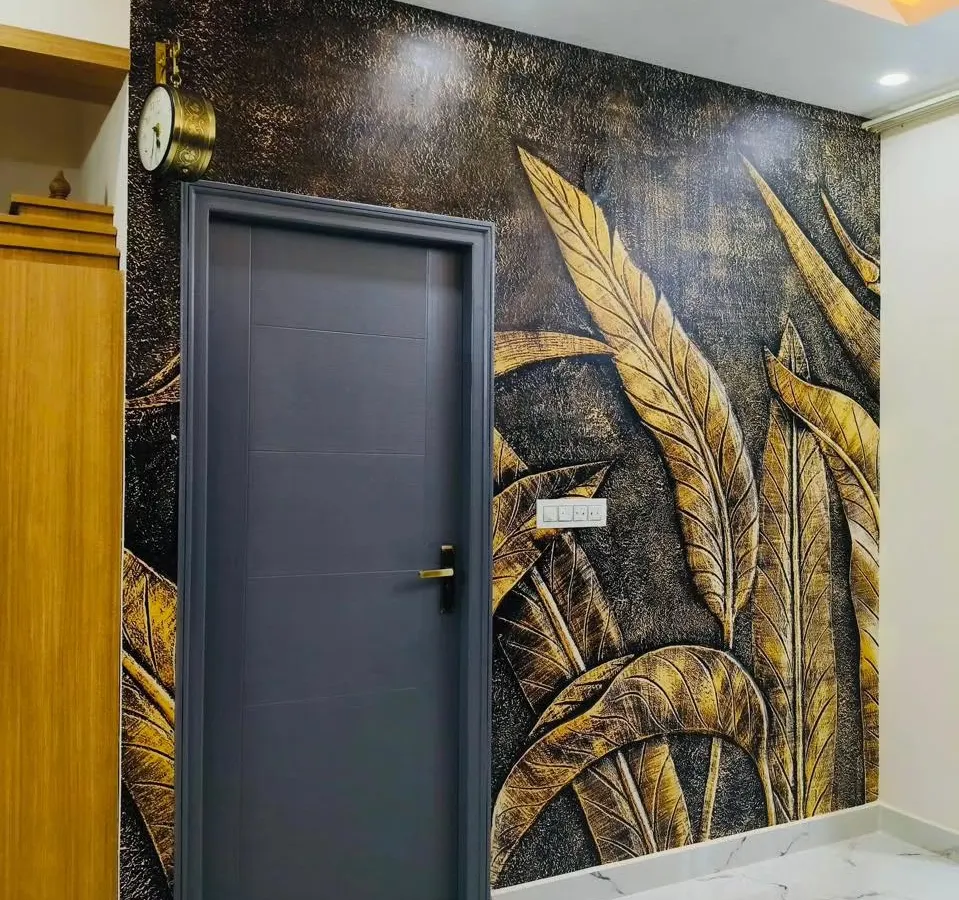 I love creating designs that have depth and texture. This 3D-effect wallpaper with golden leaves adds a touch of luxury and drama to this entryway, making a bold statement right from the entrance.