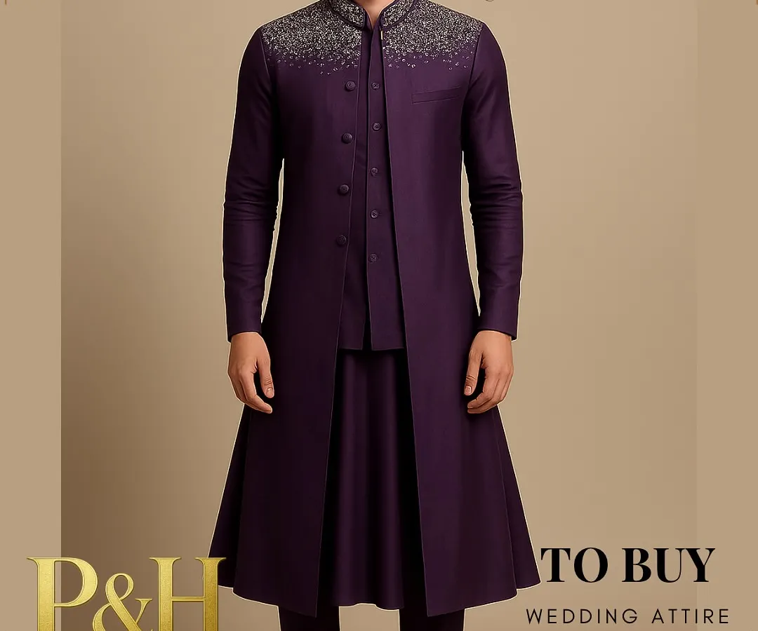 I designed this layered ensemble for the modern groom who seeks a blend of tradition and contemporary flair. It features a deep purple Anarkali-style kurta under a structured half-jacket and a long, flowing top jacket, crowned with brilliant silver hand-embroidery on the collar and shoulders.