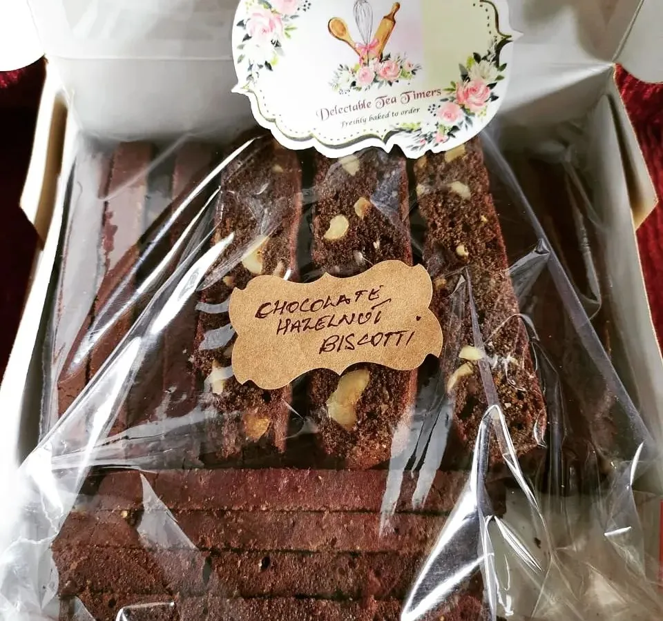 Our Chocolate Hazelnut Biscotti, packed and ready for your chai time. Each piece is twice-baked for that perfect crunch and loaded with nuts, offering a truly homemade taste you won't find in stores.