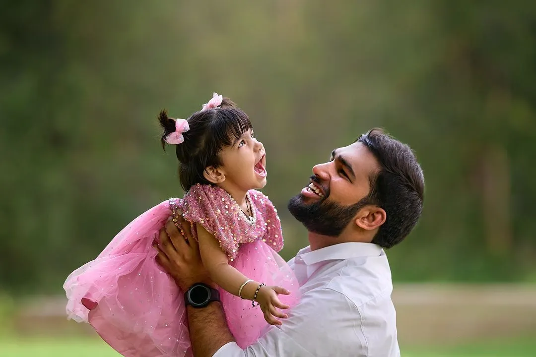 Capturing the sheer joy in a father and daughter's interaction. My goal is to photograph these energetic, happy moments that show the true spirit of your family, using natural light to highlight their expressions.