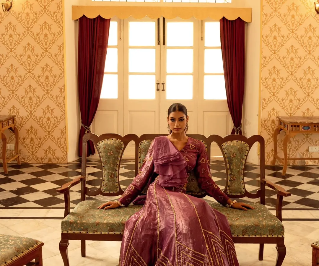 For this brand campaign, we chose a heritage palace to create a sense of timeless royalty. This wide shot was designed to showcase the grandeur of the location and the elegance of the couture gown, making the model appear regal and poised within a magnificent setting.