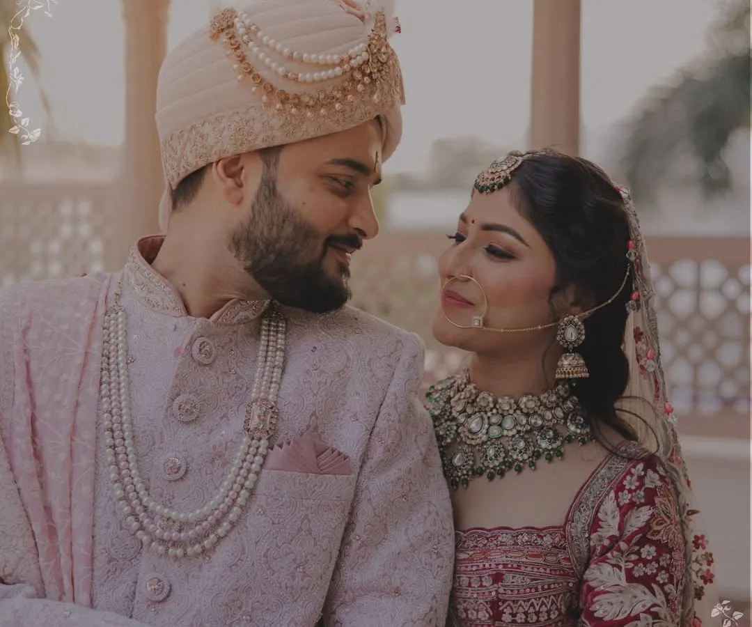 An intimate moment between the bride and groom, captured in the soft, warm light of their wedding day. These are the quiet, in-between moments that tell the real story of your love.