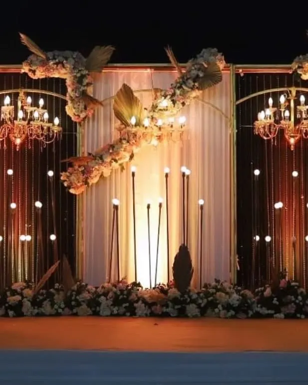 For a dramatic and unforgettable sangeet night, I designed this black and rose gold themed stage. The setup features elegant chandeliers, warm ambient lighting, and lush floral arrangements, creating a sophisticated atmosphere perfect for celebrating.