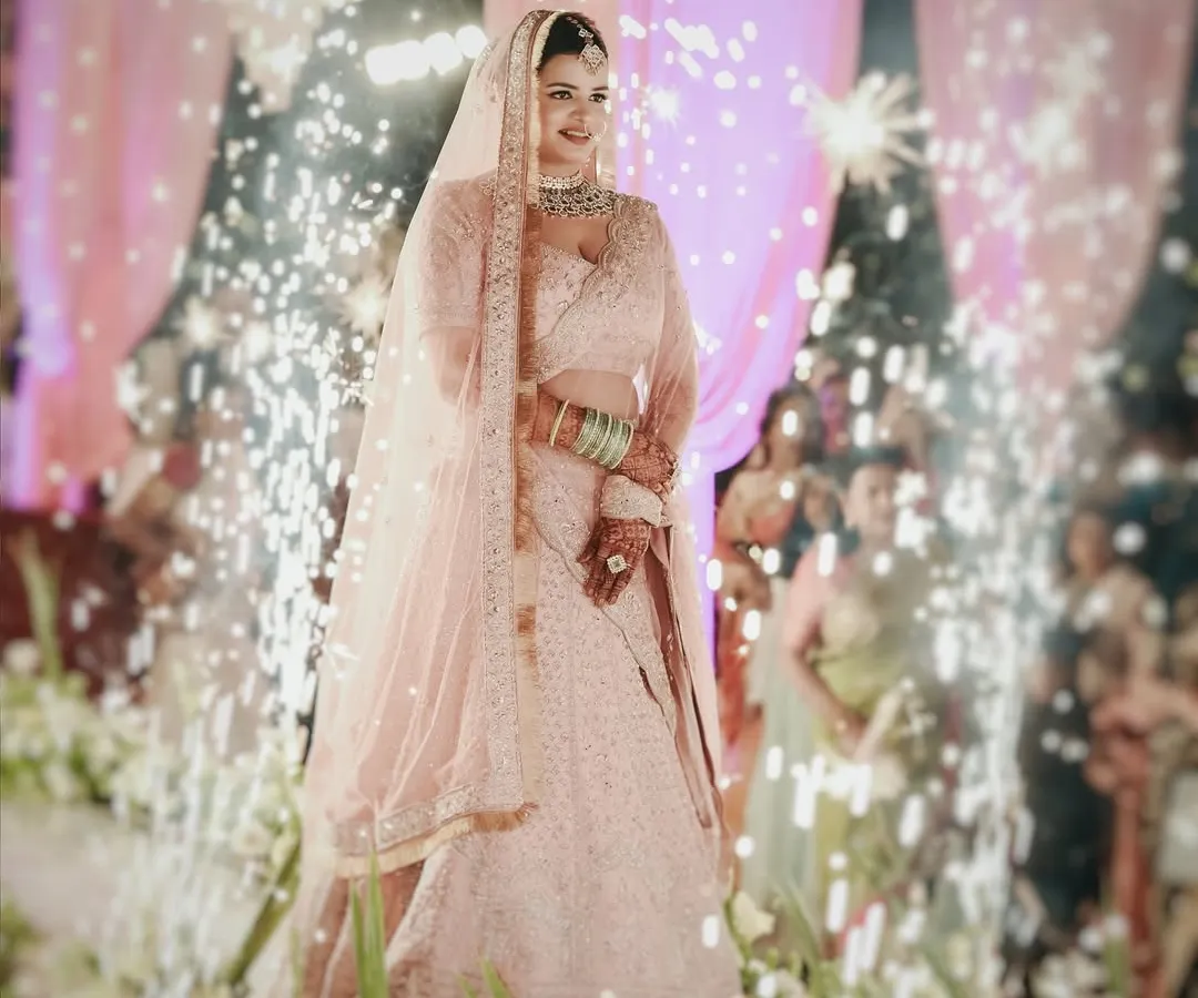 The moment a bride walks in, everything changes. I focus on capturing that grand entrance, complete with dramatic elements like these sparklers, to create a truly unforgettable image of your big day.