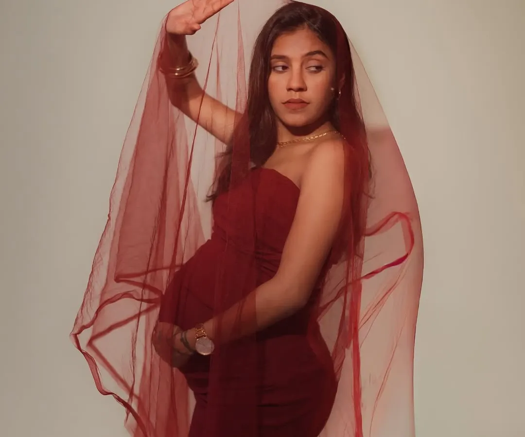 There is such power and grace in this journey. This portrait, with the deep red veil, is about celebrating the mother's strength and the timeless, artistic beauty of pregnancy.
