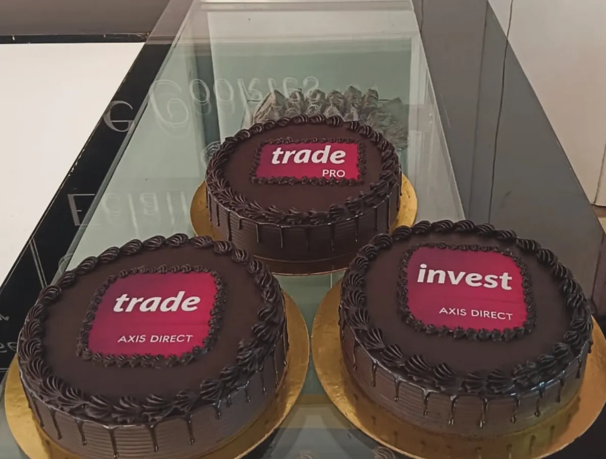 For large corporate events, I can create multiple cakes with consistent branding. This order for Axis Direct features their different service logos on rich chocolate cakes, perfect for a multi-team celebration or brand activation.