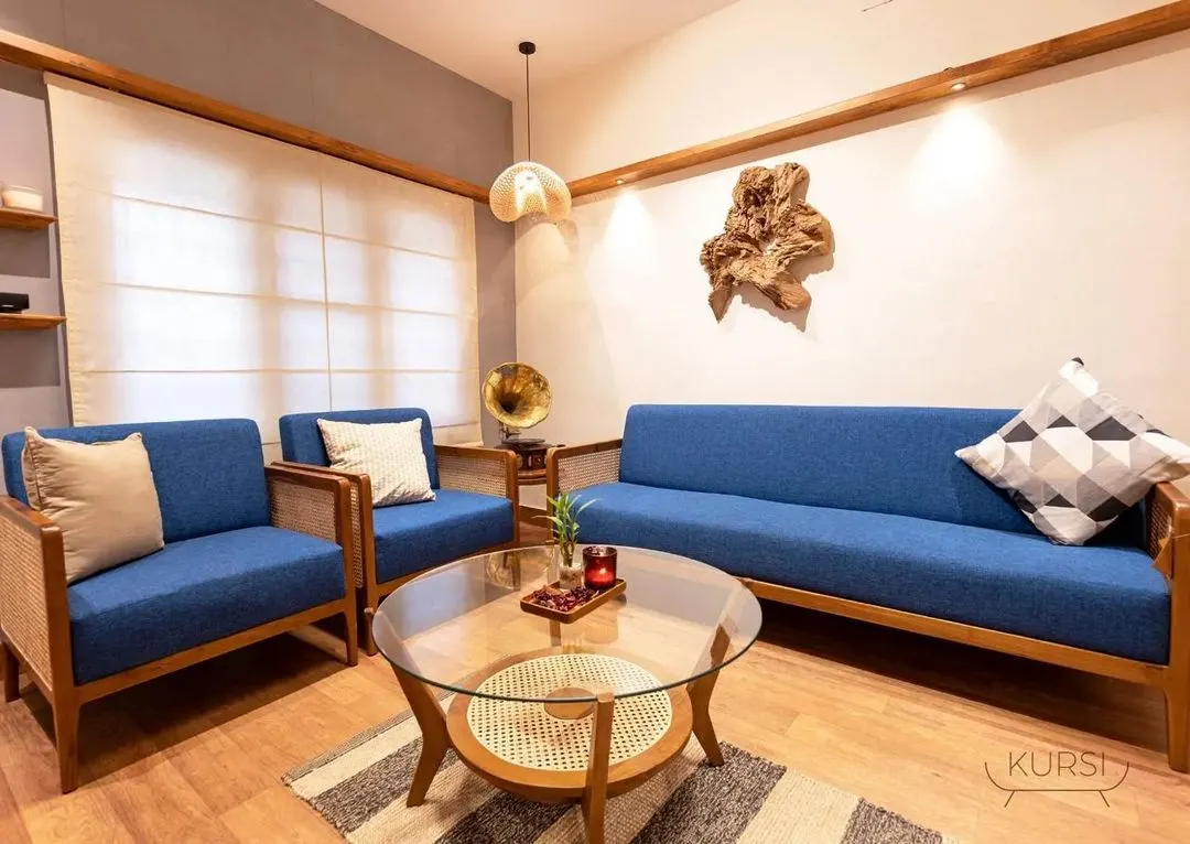 I believe furniture should bring people together. This living room set, featuring a 5-seater teak wood sofa and armchairs with vibrant blue upholstery and rattan details, was crafted to create a space that is both elegant and incredibly inviting.