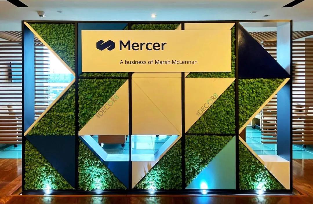 We create high-impact, maintenance-free moss walls that make a bold statement. This installation for Mercer incorporates their branding directly into the design, turning a reception wall into a unique piece of corporate art that reinforces their identity.