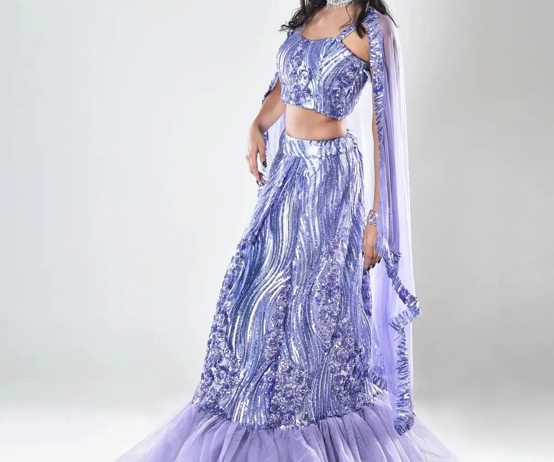 A full-glam engagement look featuring a shimmery lavender lehenga. I focused on creating a flawless base, bold eyes, and a complementary lip color to match the modern, mermaid-style silhouette of the outfit.
