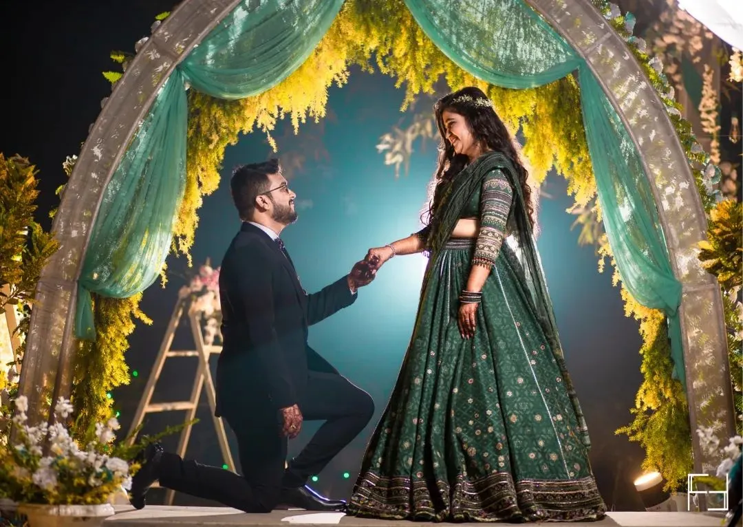 "Will you?" A moment suspended in time. I focus on creating a dramatic, cinematic feel for your most pivotal memories, ensuring the grandeur of the question is matched by the beauty of the photograph. This is a core memory from a Delhi wedding engagement.