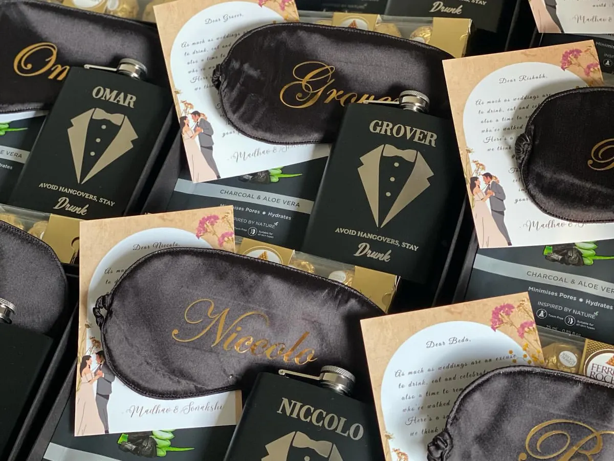 Here’s a look at my custom groomsmen proposal boxes. I focus on sleek, practical gifts like personalized hip flasks and eye masks, premium grooming products from The Man Company, and of course, some Ferrero Rocher for a touch of sweetness.