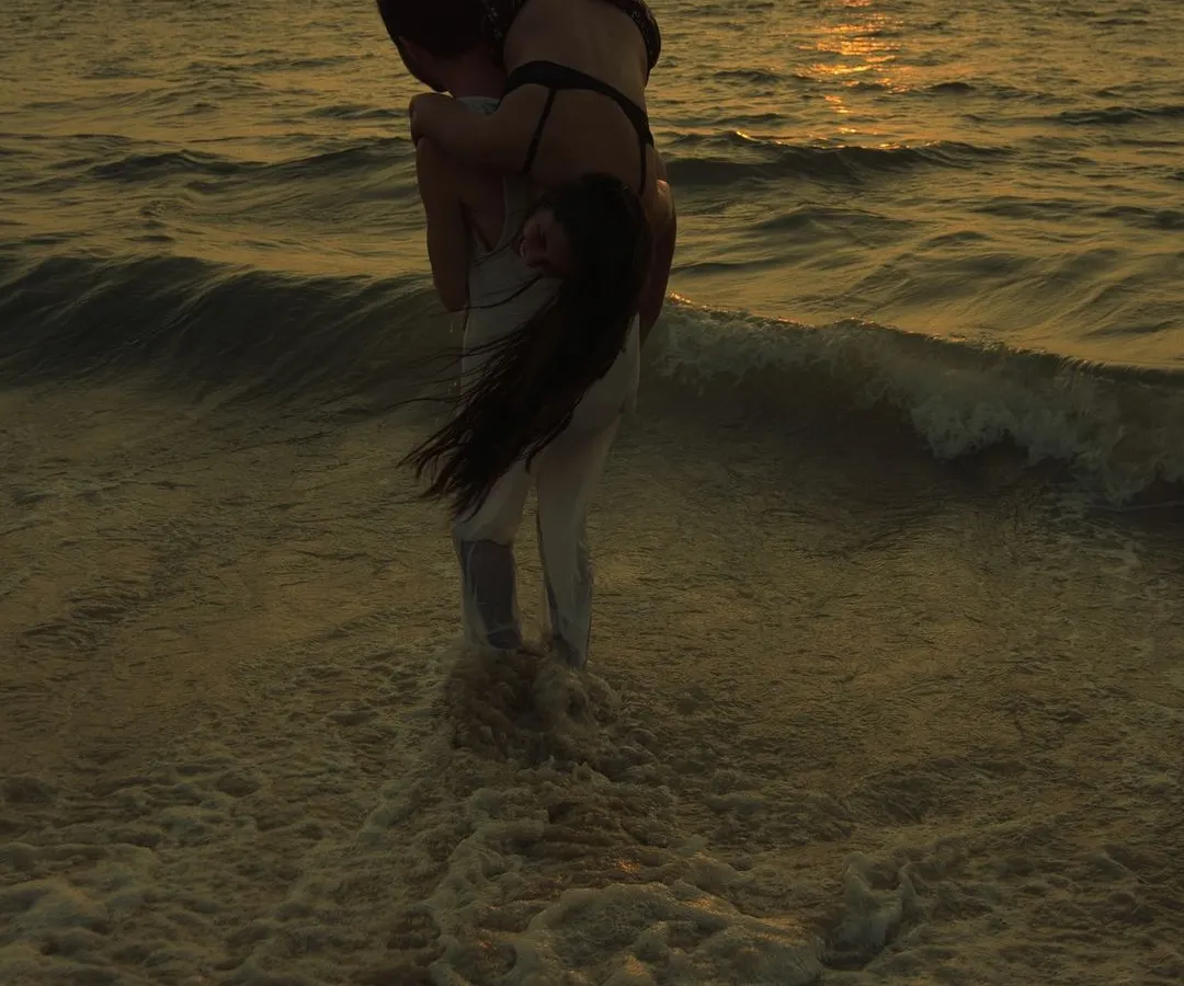 A golden hour pre-wedding photo from a shoot in Kochi. I use the sunset to create dramatic silhouettes and warm, cinematic colors, turning a playful moment in the waves into a piece of art.