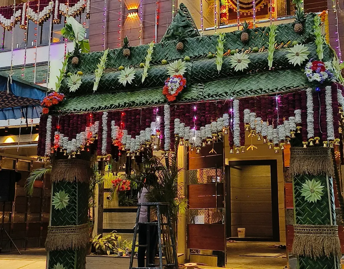 This is an example of my specialty in traditional South Indian decoration. I crafted this entire entrance arch for a home function using hand-woven fresh coconut leaves, creating an authentic and auspicious welcome for guests.