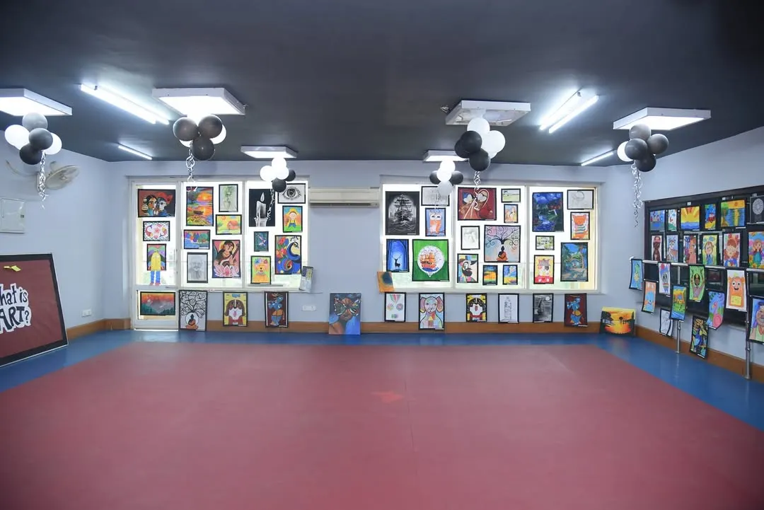 A wide view of our annual Fine Arts Exhibition at the Dhwani Kala Mahotsav. We transform our space into a professional gallery to showcase the amazing work of our students, giving them a real-world platform to display their talent.