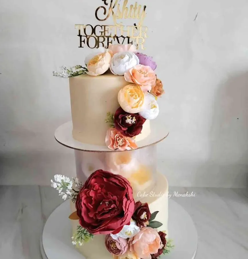 My signature floating tier cakes bring a touch of magic to any celebration. This floral engagement cake creates a beautiful illusion that gets everyone talking, making your special moment even more memorable.