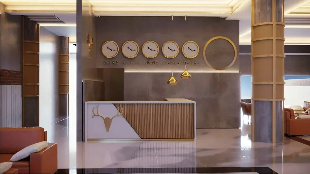 This modern reception area is a perfect example of our branded environment design. We created a custom desk that combines natural wood textures with a clean, white finish and integrates the company's logo. The feature wall with multiple time zone clocks adds a functional, global touch, ideal for a contemporary corporate office.