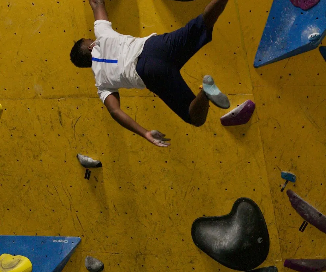 This is the feeling of flying. A perfectly executed dyno during one of our special sessions, capturing the power and excitement of advanced bouldering. We set up these dynamic challenges to help you push your limits.