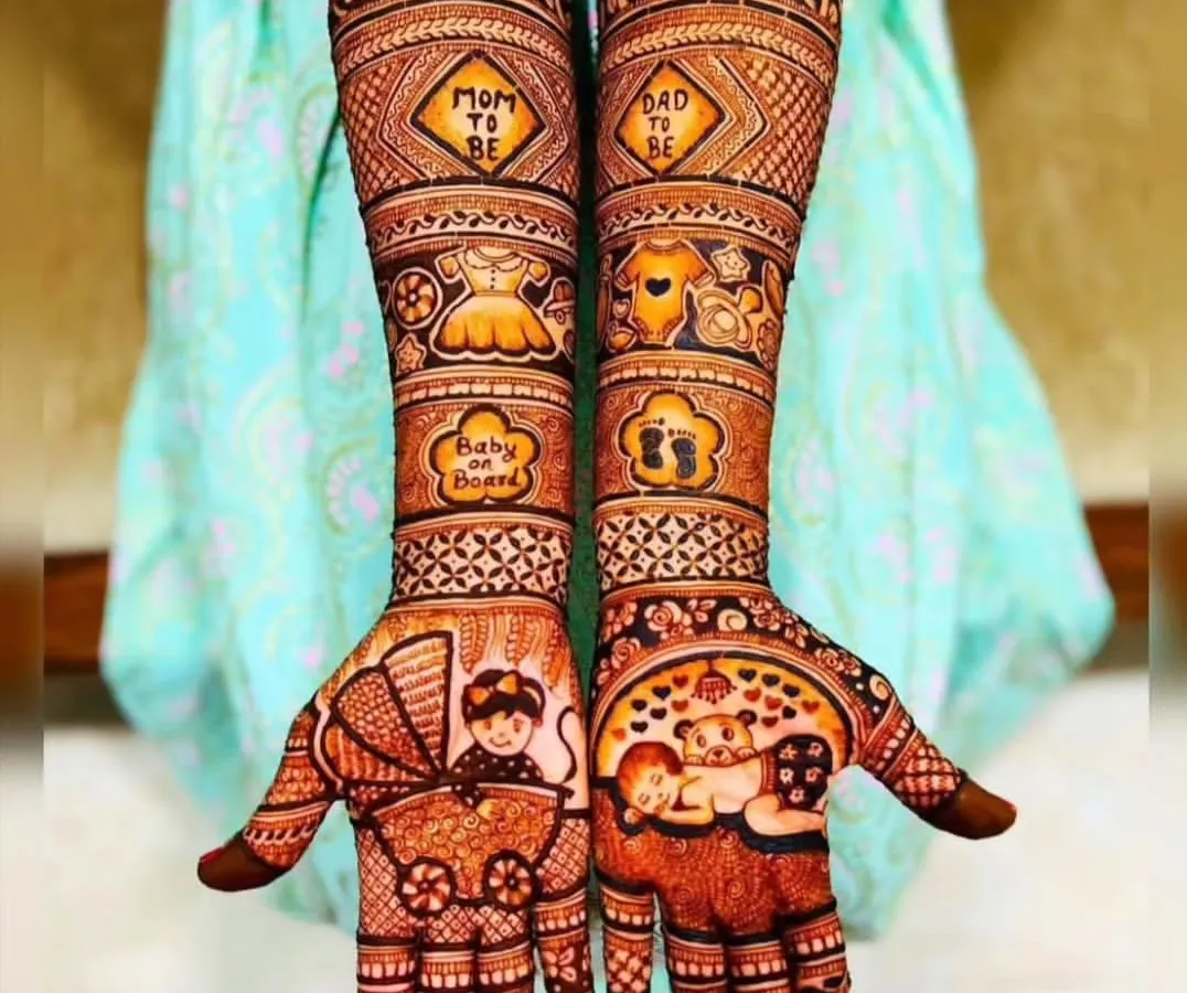 I love creating special designs for moms-to-be. This Godh Bharai or baby shower mehndi is filled with cute, celebratory details like a baby carriage, tiny clothes, and "Mom to be" messages to make the day unforgettable.
