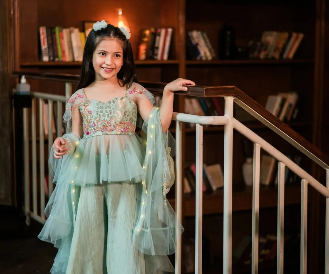 Capturing the pure joy of childhood is a privilege. For this kids' couture brand shoot, we created an elegant, festive atmosphere where this little model's bright smile and the dress's delicate details could truly shine.