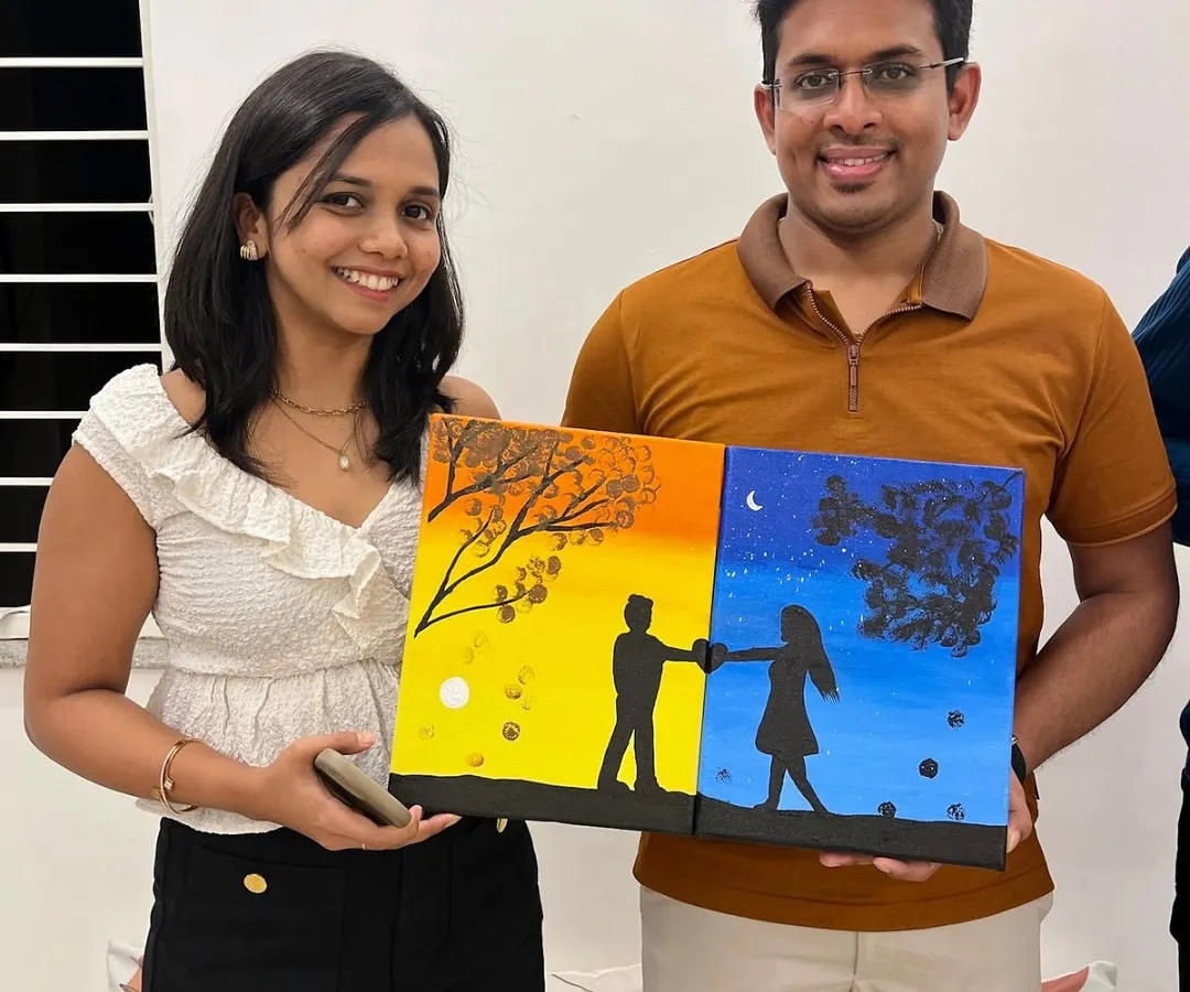 Art is the perfect date night. This happy couple is showing off their completed diptych painting, a two-part canvas that creates one beautiful picture. Our Sip and Paint sessions are a fantastic way to connect and create something meaningful together.